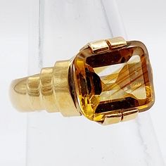 French art deco signet ring 18k gold set with a 3.10 carat citrine in a geometric setting (circa 1940) tank domed  Magnificent French art deco work Size: 52 FR / 6 US Weight: 6.65g Citrine size: 9 x 10 x 5 mm (estimated at 3.10 carats) Citrine very slightly offset in its setting; remains very well maintained Micro scratches on the edges of the citrine Hallmarks erased by old resizing Visit my shop for even more antique jewelry: https://www.etsy.com/shop/AugustusJewels Classic Gold Citrine Signet Ring, Art Deco Citrine Gold Rings, Art Deco Gold Citrine Rings, Art Deco Yellow Gold Topaz Ring, Art Deco 14k Gold Topaz Ring, Gold Art Deco Signet Ring With Gemstone, Art Deco Citrine Topaz Ring For Formal Occasions, Huge Crystal, Tank Art