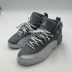 NIKE AIR JORDAN 12 RETRO GS GREY WHITE KIDS YOUTH SIZE 4.5Y 153265-015 EXCELLENT CONDITION, NO BIG DAMAGE, MINIMAL WEAR, THESE WERE MY SONS AND HE BARELY WORE THEM AND NOW THEY NO LONGER FIT HIM, THEY ARE STILL IN GREAT SHAPE AND SUPER NICE WITH MINIMAL WEAR, THE PHOTOS SHOW EVERYTHING ABOUT THE ITEM, CHECK ALL PHOTOS FOR CONDITION AND INFORMATION ON THE ITEM. THE ITEM IN PHOTO IS THE EXACT ITEM YOU WILL RECEIVE IF PURCHASED IF YOU HAVE ANY QUESTIONS JUST REACH OUT TO ME AND I WILL GET BACK WITH YOU ASAP, THANK YOU. IF YOU DO DECIDE TO PURCHASE AND HAVE ANY ISSUES AT ALL JUST REACH OUT TO ME BEFORE LEAVING ANY KIND OF FEEDBACK AND I WILL HELP RESOLVE ANY ISSUE YOU MAY HAVE IMMEDIATELY, THANK YOU FOR LOOKING AND SHOPPING WITH ME!! SMOKE FREE HOME, ALL ITEMS IN HAND. SAME DAY OR 1 DAY HANDLI Air Jordan 12, Air Jordan 12 Retro, Jordan 12 Retro, Jordan 12, Jordans 12, Nike Air Jordan, Air Jordan, Grey And White, Air Jordans