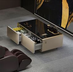 a modern coffee table with two drawers on the bottom and one drawer open in front