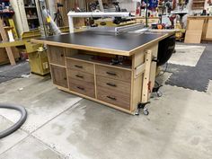 a workbench in a garage with tools on it