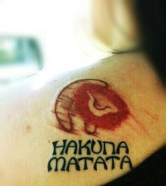 a tattoo with the words hakuna matata and an elephant on it's shoulder