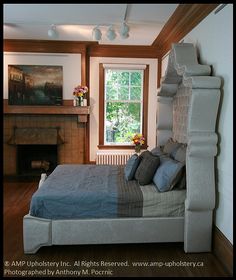 a bedroom with a bed and fireplace in it