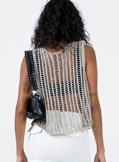 Show off your trendsetter style in this allery crochet knit sleeveless tank. Crafted from lightweight, airy fabric, this stylish tank is perfect for all your summer looks. It's the perfect companion for your shorts, jeans, and skirts! (And yeah, you look totally hot in it). Size Guide: Model is 5’5” tall, and has a 33.1” bust, 24.6”waist, & 37.2” hips. She is wearing a S / US 4 / AU 8. This tank is true to size. Material: 100% Acrylic. Key Features: Relaxed fit. Pull-on. Crochet Knit Fabrication Open Knit Layering Tank Top, Stretch Tank Vest For The Beach, Stretch Tank Vest For Beach, Summer Pointelle Knit Tank Top For Layering, Summer Tank Top For Layering In Pointelle Knit, Summer Layering Tank Top With Pointelle Knit, Chic Crochet Knit Top For Layering, Chic Open Knit Sweater Vest, Chic Sleeveless Crochet Top