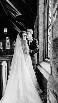 black and white photo of bride and groom in church