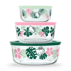 three glass bowls with hello kitty designs on the front, one green and one pink