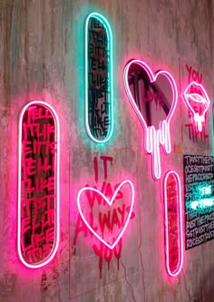 neon signs on the side of a building