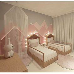 two beds in a room with pink and white walls