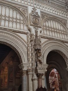 the inside of an ornate building with columns and arches