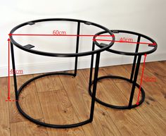 two black metal tables with measurements for each table