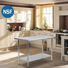 a white kitchen island in the middle of a room with beige cabinets and tile flooring