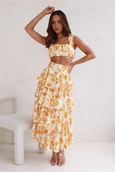 Length from waist to hem of size S: 95cm. Maxi skirt.  Yellow and orange print.  Unlined. Model is a standard XS and is wearing size XS. True to size. Non-stretch. Tiered frills. Zipper with hook eye closure. Print placement may vary. Cold hand wash only. Polyester.  Lovely, this is your reason to shop! The Event Of The Season Maxi Skirt features gorgeous tiered frills with a flowy design. Style with the matching  for a 'fit you'll love. Homecoming Romper, Party Rompers, Maxi Rok, Flowy Design, Knit Outerwear, Orange Print, Dresses Backless, Print Placement, Printed Rompers