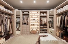 a walk in closet filled with lots of clothes