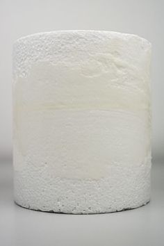 a close up of a white toilet paper roll