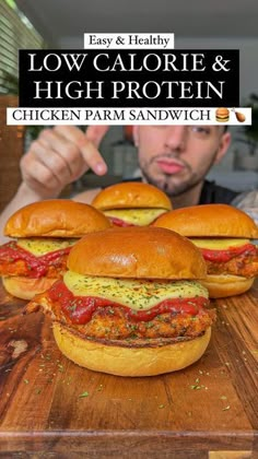 a man pointing at several sandwiches on a cutting board with the title low calorie and high protein chicken parm sandwich