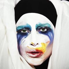 a woman with painted face and white clothing