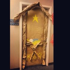 a door decorated to look like a nativity scene with the star of david on it