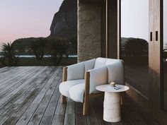 a white chair sitting on top of a wooden deck