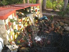 an outdoor fountain with water spouting from it