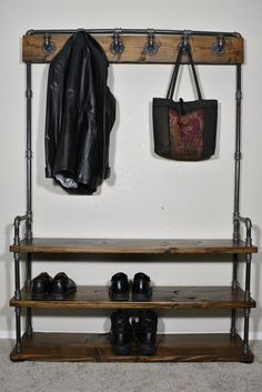 a coat rack with shoes and a purse hanging on it