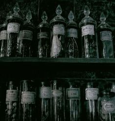 many jars are lined up on the shelf