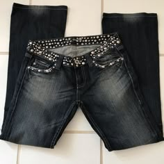 These Are Fantastic! They Have Silver Studs And Black Crystals Mounted In Silver Covering The Whole Waist Band, Going Across The Front Pockets And Covering The Full Flap On Back Pockets. The Are A Dark Blue Distressed With Flare Legs. They Have 32in Inseam. They Have Never Been Worn Or Cleaned. The Distressing Is Great Too. They Are Definitely Some Something Special Jeans Jeans With Crosses On Them, Blingy Jeans, Thrift Manifestation, Special Jeans, Bedazzled Jeans, Rock Jeans, Flair Jeans, Art College, Digital Closet