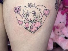 a woman's thigh with a drawing of a princess on it and hearts in the shape of a heart