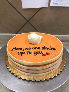 a cake with writing on it that says mom, no one sticks up to you