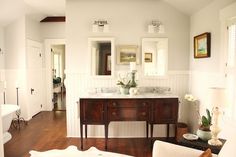 a living room filled with furniture and a white couch