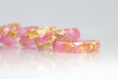 Say hello to Spring!! These resin rings are stunning with bright pink eco resin and 22K gold flakes throughout... It is faceted all the way around giving it the appearance of a gem. Such a comfortable ring to wear, and it is perfect for stacking with other rings. Each piece goes Jewelry Stack, Ring Resin, Resin Rings, Faceted Ring, Eco Resin, Flamingo Pink, Stack Ring, Textured Ring, Resin Ring