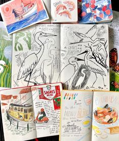 several children's books with drawings on them