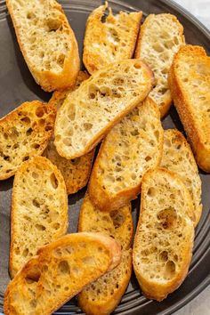 slices of garlic bread on a plate ready to be eaten