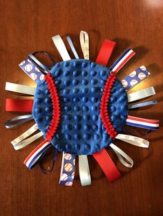 a wooden table with scissors and hair clips on it's side, in the shape of a sunburst