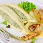 a white plate topped with food next to a fork