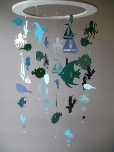 a mobile with sea creatures hanging from it's sides