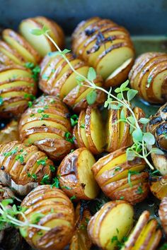 roasted potatoes with herbs and seasoning in a pan