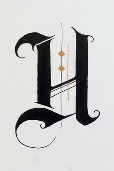 the letter h is made up of black and white letters with gold trimmings