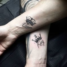 two people with matching tattoos on their arms, one is holding the other's hand