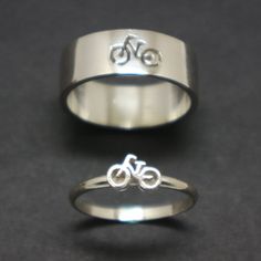 "Introducing Bicycle Ring made in Sterling Silver. Great gifts for bicycle lovers. It will make a great statement for you and your boyfriend or husband. Having this rings just fun and enjoyable between couple. You may get the rings in a set of two or as in one ring. Great deal for buying both rings. You can also write your ring sizes on both ring in the order detail section upon purchase. Base Material: 925 Sterling Silver Men Ring Depth: 9mm (Approximately) Women Ring Depth: 6mm (Approximately) Couple Bike, Ring For Couple, Bike Jewelry, Bike Couple, Silver Men Ring, Promise Rings For Couples, Sports Jewelry, Couple Wedding Rings, Silverware Jewelry