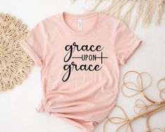 Description Grace upon grace, Grace Shirt, Christian Gift, Faith Gift, Christian Shirts , Love and Grace Shirt, Faith Cross, heart faith, Jesus     HOW TO ORDER      1. Check photos for sizing and color options  2. Select size and color from the drop-down menus  3. Add to cart & Place order  4. Your shirt is now off to production and will be ready for shipment in 1-3 days!      SHIRT SIZING    All shirts come in 12+ colors and 6 sizes, ranging from Small to 3X-Large.    PRODUCTION & SHIPPING God Is My Refuge, Psalms 91, Christian Shirts Designs, Christian Tshirt, Ayat Alkitab, Christian T Shirts, Faith Gifts, Psalm 91, Tshirt Pattern