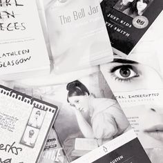 black and white photograph of various books with eyeliners on them, including one woman's face