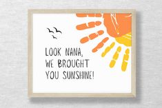 an orange and yellow print with the words look mama, we brought you sunshine