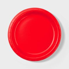 a red paper plate on a white background