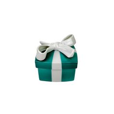 a green and white box with a bow on it