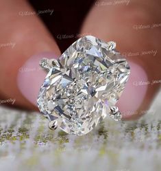 a person holding a diamond in their hand