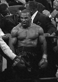 a black and white photo of a man with his face painted like a wrestler, surrounded by other men