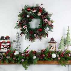 Make a statement this holiday season with this stunning mixed pine artificial wreath. Features a mix of green pine foliage and is adorned with colorful ball ornaments in traditional Christmas hues of red white silver and gold adding a touch of holiday sparkle and cheer. Perfect for greeting guests at your front door adorning your mantel or as a centerpiece for your holiday table. This beautiful wreath is sure to bring the holiday spirit to your home. Product features: Unlit. Features a mix of gr Artificial Wreath, Holiday Sparkle, Ball Ornaments, Holiday Tables, Beautiful Wreath, Christmas Balls, The Holiday Aisle, Pink Christmas, Pine Cones