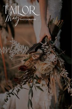 a person holding a bouquet with white flowers and greenery on it, in front of the words tailor