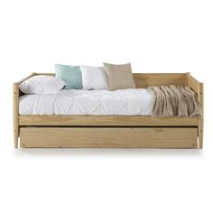 a wooden daybed with pillows and blankets on it's sides, against a white background