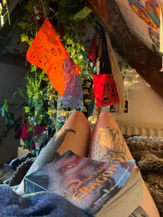 a person laying down with their feet up on some books