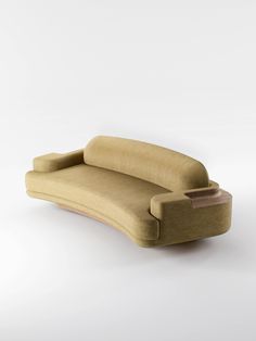 a couch that is made out of wood and has a wooden armrest on it